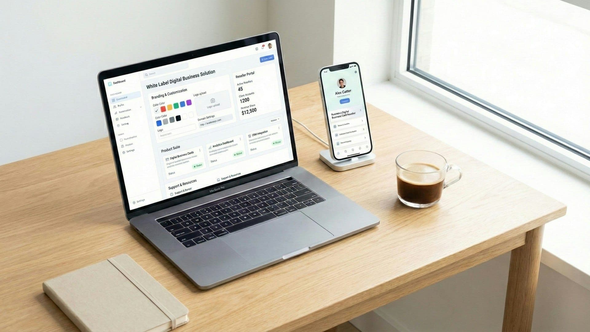 Laptop showing a business dashboard beside a phone and a cup of coffee on a wooden desk